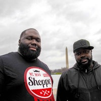 two men standing in front of the washington monument